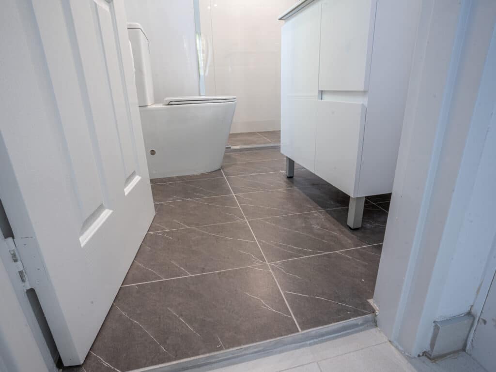 Understanding the Difference Between Bathroom Leak Repair and Full Renovation